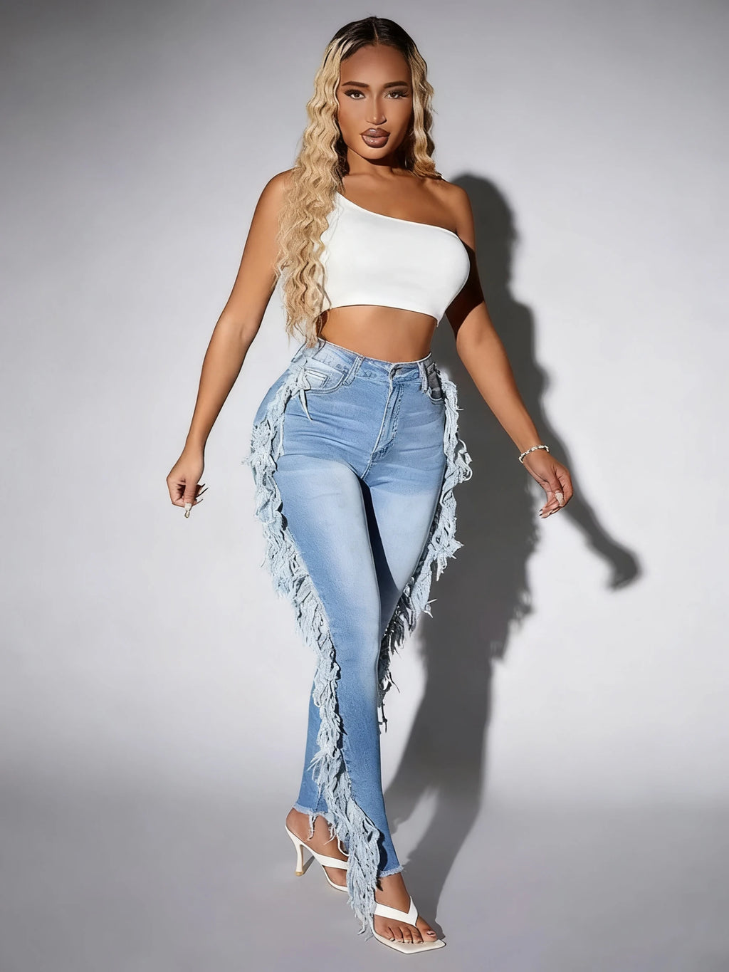 Ladies' light blue skinny jeans; slim-fit, mid-rise, stretchable, fashionable, denim ankle pants.