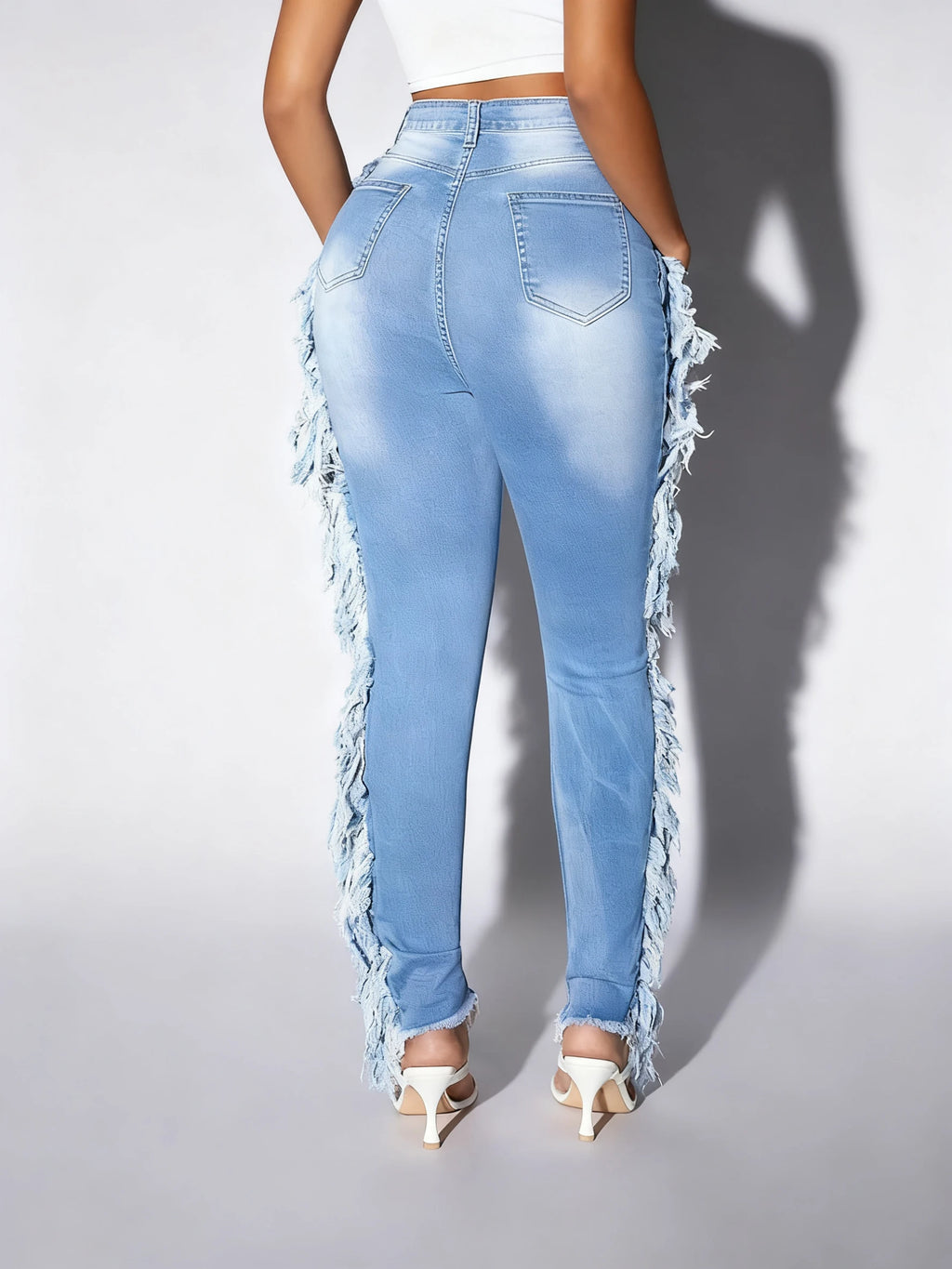 Ladies' light blue skinny jeans; slim-fit, mid-rise, stretchable, fashionable, denim ankle pants.