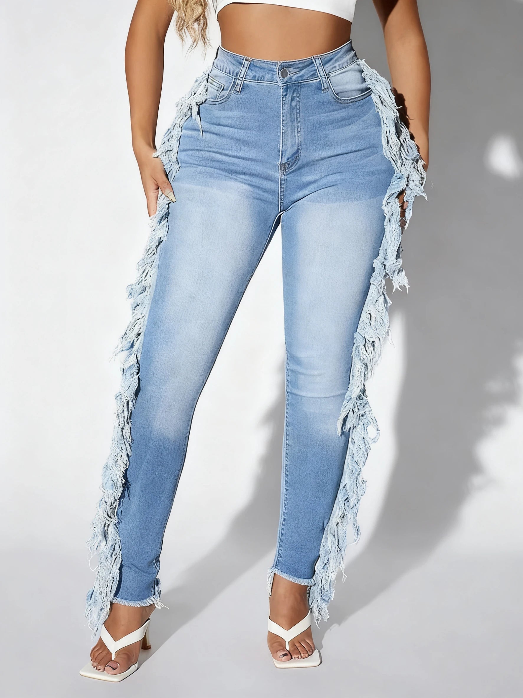 Ladies' light blue skinny jeans; slim-fit, mid-rise, stretchable, fashionable, denim ankle pants.