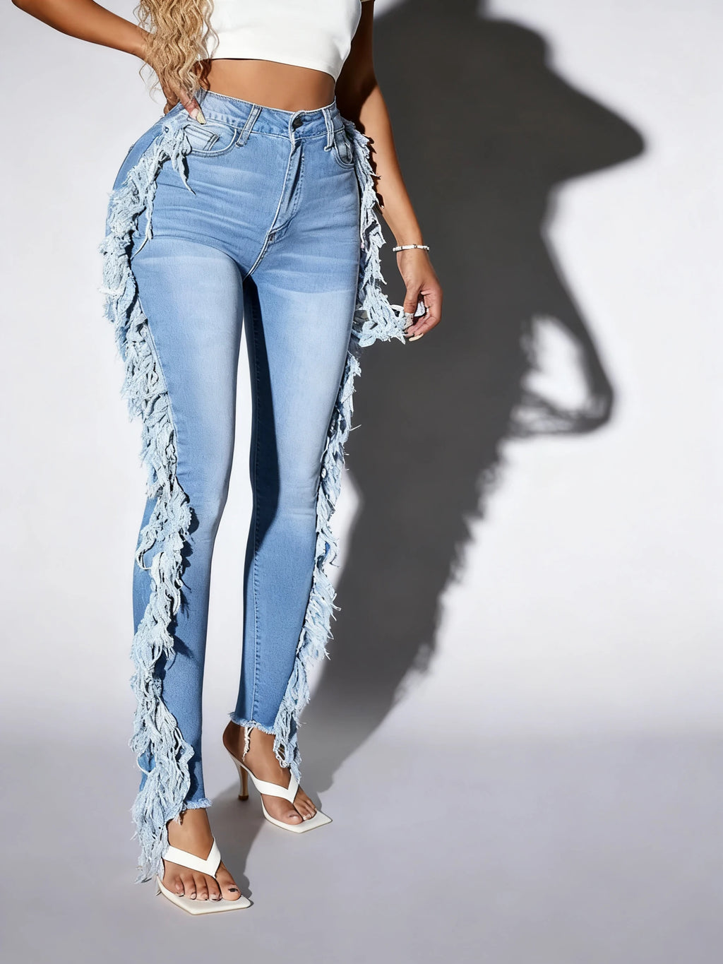 Ladies' light blue skinny jeans; slim-fit, mid-rise, stretchable, fashionable, denim ankle pants.